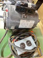 Full view of Craftsman motor with attached cord and receptacle box