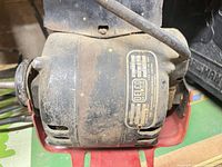 Left side view showing full motor and mounting base