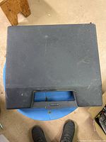 Closed black plastic carry case, exterior view