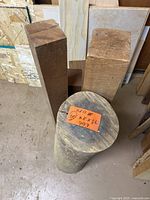 Two rectangular wood blocks and cylindrical log standing upright
