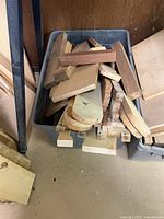 Tote containing assorted hardwood pieces such as boards and curved cut-offs