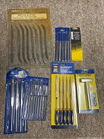 All packaged tool sets arranged on floor