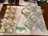 Group view of all amber triangular and clear square candle holders on table