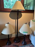 Full view of floor lamp and two table lamps with shades