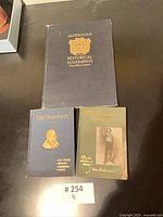 Front covers of all three books displayed together