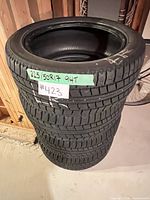 Stack of four Nitto NT-SN2 tires showing tread and size label 225/50R17 94T