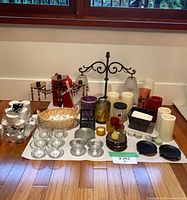 Group shot of entire candle accessory lot on floor