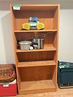Front view of oak bookcase with adjustable shelves, contents excluded