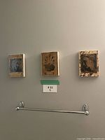 Front view showing all three canvas blocks mounted on wall