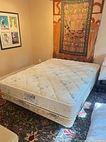 Full view of mattress on boxspring and bedframe