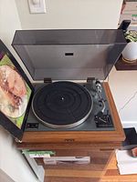 Turntable with Van Morrison record jacket and cabinet