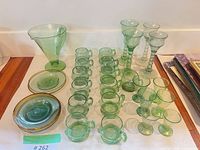 Full lot showing all green glass pieces arranged