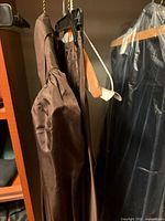 Jacket and skirt hanging, showing color and fabric