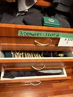 Three drawers showing multiple folded sweaters, Sweatshirt, Sweater Stone case