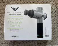 Retail box showing Hypervolt percussion massage device branding and image