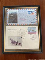 Overall view of framed Air France first day covers showing both envelopes, stamps and cancellations