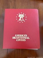 Front cover of red binder titled America's Bicentennial Covers