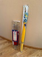 Both packaged items: beach umbrella and flag set