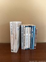 Front view of the eleven C.S. Lewis books standing upright