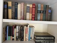 Two-shelf view showing majority of hardcover titles