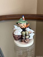 Front view of Goebel Hummel "Playmates" figurine