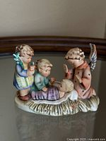 Front view of Hummel Silent Night figurine showing all characters and candle holder