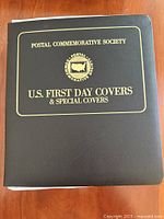 Cover of binder showing title and society emblem