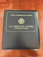 Front of black album with gold lettering