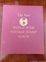 Front cover of maroon hardcover album showing title