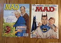 Front covers of both MAD magazine issues showing issue numbers and cover art