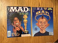 Front covers of both MAD magazines