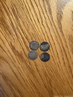 Four Canadian dimes grouped obverse side visible