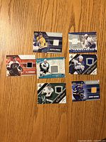 Front view of all seven jersey cards showing swatches and player images