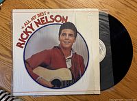 Front cover of Ricky Nelson All My Best LP with record partially exposed