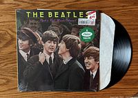 Front jacket of The Beatles Rock 'N' Roll Music Volume 1 with vinyl partially visible