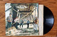 Front jacket, inner sleeve and vinyl record displayed