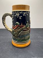 Front view showing relief scene and text