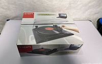 Front angled view of boxed ION Profile Pro USB turntable