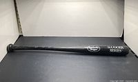 Full view of Louisville Slugger bat showing Slugger Series branding