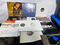 Overview of ten 12-inch records laid out on table