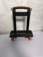 Cart standing folded with handle retracted