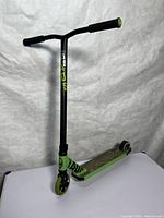 Full view of Madd Gear stunt scooter standing upright