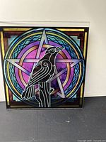 Raven on Pentacle stained glass insert showing design and color