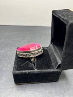 Ring in box, top view showing ruby and band