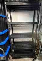 Front view of full shelving unit showing four shelves