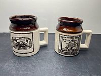 Both Abenakis Pottery mugs front view