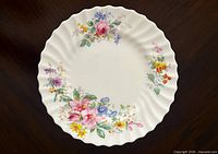 Front view showing floral Arcadia pattern and fluted rim