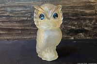 Front view of frosted glass owl with blue rhinestone eyes
