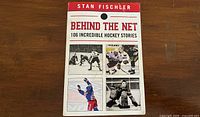Front cover showing title, author and hockey images