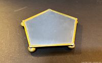 Top view of brass-framed mirror hexagon stand